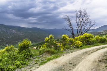 Dirt road on the edge of a mountain slope