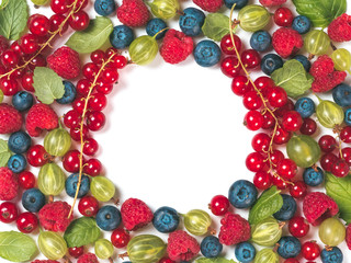 Various fresh summer berries background with copy space for text in center.Creative layout of fresh blueberries,red currant, raspberries, gooseberries isolated on white background.Top view or flat lay