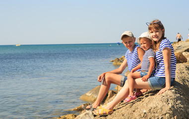 Three children on the beach