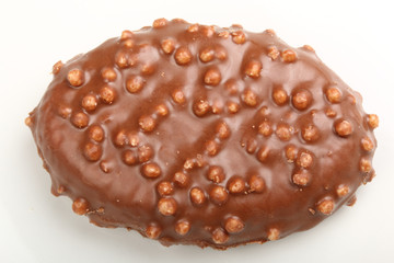 Single chocolate candy with Rice Krispies Cereal on a white