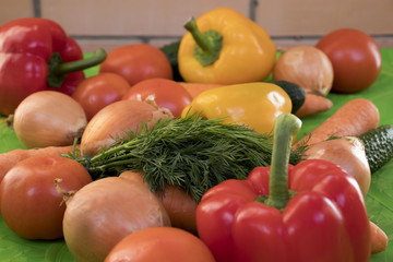 Set of various colorful fresh raw vegetables on a colored background