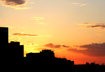 sunset sky over city buildings