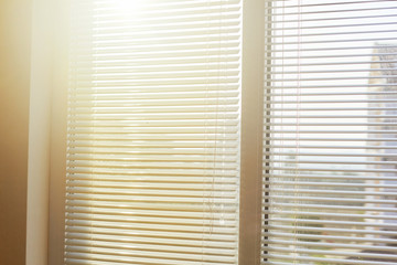 Blinds in a home catching the sunlight