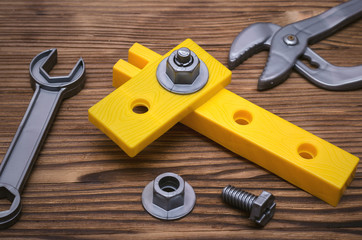 Construction background. Wrench and wood units. Bonding building elements.