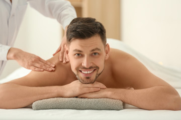 Fototapeta na wymiar Man having massage in spa salon