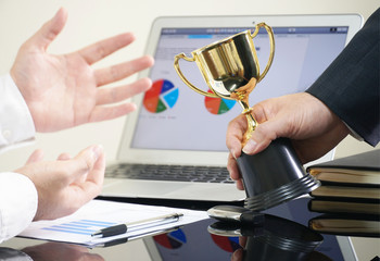 Businessman give trophy for marketing stuff for achive the target,win concept.