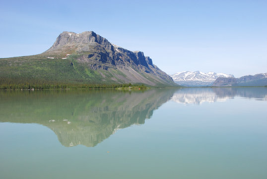 Mount Tjakkeli water reflection on turquoise lake Laitaure