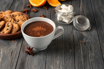 Cup of hot chocolate on wooden table