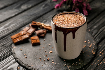 Cup of hot chocolate on slate plate