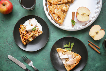 Plates with pieces of tasty apple pie on table, top view