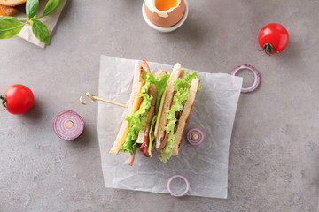 Tasty sandwich with lettuce on table