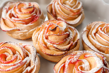 Tasty rose shaped apple pastry on dish, closeup