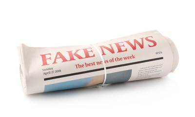 Rolled newspapers on white background