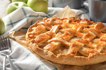 Tasty homemade apple pie on napkin