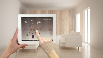 Smart remote home control system on a digital tablet. Device with app icons. Minimalist modern...