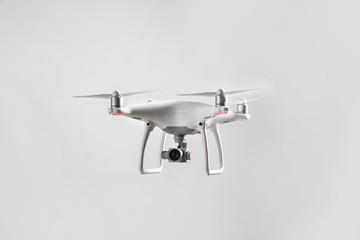 Modern quadcopter on grey background