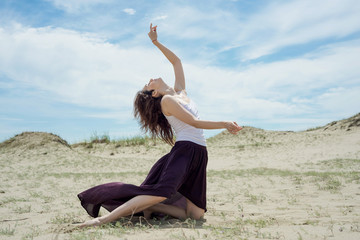 Young woman dancing in nature