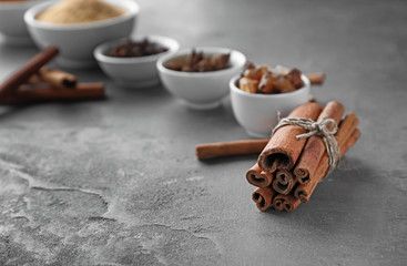 Aromatic cinnamon sticks on grey background