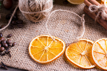 Dried orange on wooden background. Rings of dried citrus