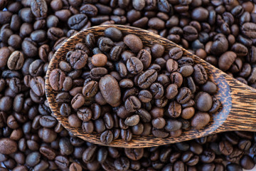 Coffee beans on wood spoon
