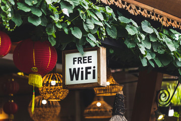 Free Wi-Fi sign hanging in traditional chinese street restaurant - 214566018