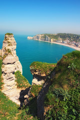 Picturesque landscape on the cliff, city of Etretat and the English Channel in sunny spring day. Etretat, Seine-Maritime department, Normandy, France