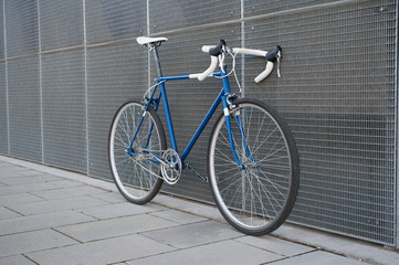 Vintage blue city, road bicycle with white details.