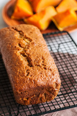 Freshly baked pumpkin pound cake with cream cheese filling served on a wire rack