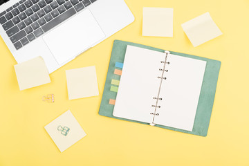 notebook on yellow background