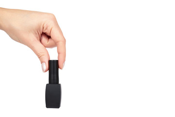 Black nail polish bottle with hand isolated on white background, copy space template
