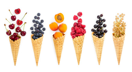 Set of assorted berries and fruit in waffle ice cream cone. Concept of healthy eating.