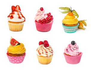 Set of different cupcakes isolated on white background.