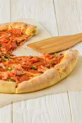 Pizza on a white woodwn table