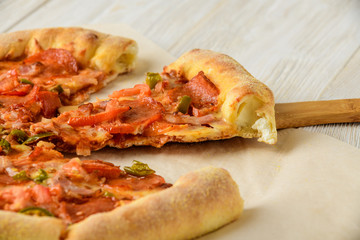 Pizza on a white woodwn table