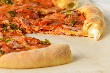 Pizza on a white woodwn table