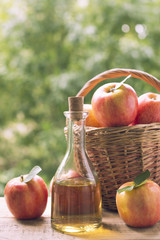 Apple cider vinegar in bottle with apple