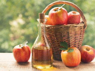 Apple cider vinegar in bottle with apple