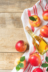 Apple cider vinegar in bottle with apple