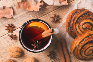 Traditional mulled wine in mug with pastry