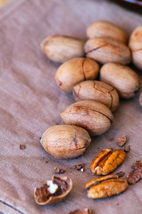 Heap of raw pecan nuts on a napkin