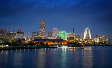 illuminated buildings on waterfront in Yokohama at night