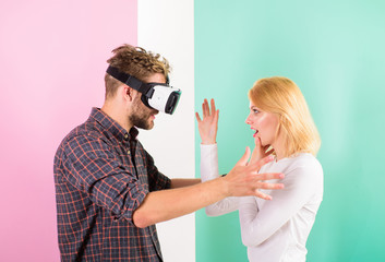 She is invisible for him. Man VR glasses involved video game while girl try to wake him up. Video game addiction symptoms and treatment. Video game captured imagination of guy