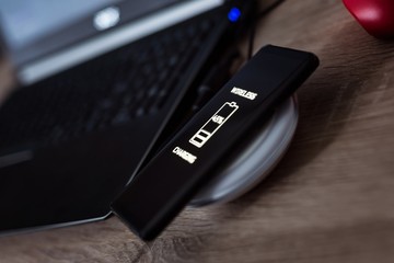 Cellphone wireless charging on induction charger.