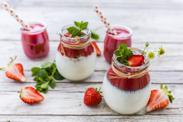 Healthy and delicious strawberry smoothies with grains and fresh fruits in jar. 