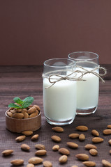 Almond milk,two glasses on the table with almond.