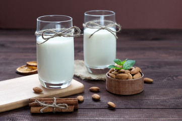 Almond milk,two glasses on the table with almond.