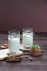 Almond milk,two glasses on the table with almond.