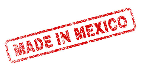 MADE IN MEXICO stamp seal print with grunge style. Red vector rubber print of MADE IN MEXICO text with dust texture. Text caption is placed inside rounded rectangle frame.