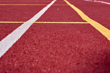 Decorative rubberized Jogging coating at the street stadium in outdoor with white line. Sport Background