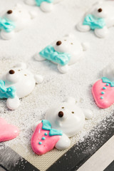 Cute bear faces marshmallow on baking tray. Making funny food